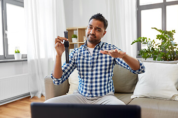 Image showing male blogger recording video review of smart watch