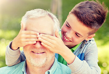 Image showing grandfather and grandson playing at summer park