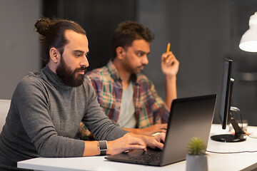 Image showing creative team with computer working late at office