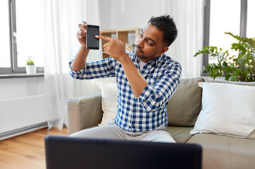 Image showing male blogger with smartphone videoblogging