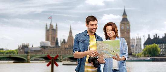 Image showing couple of tourists with map and camera in london