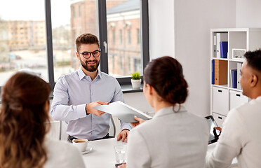 Image showing male employee having job interview with recruiters