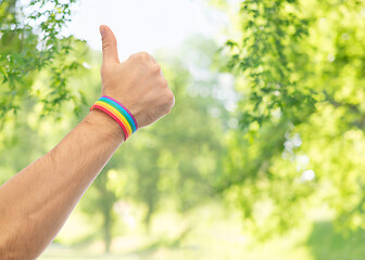 Image showing hand with gay pride rainbow wristband shows thumb