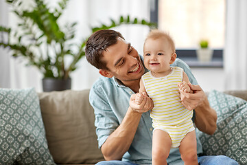 Image showing father with little baby daughter at home