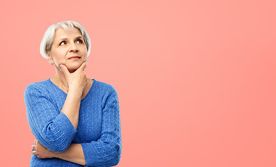 Image showing portrait of senior woman in blue sweater thinking