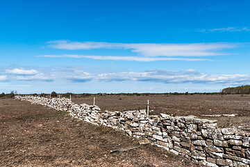 Image showing Boundry of a traditional dry stonewall in a great grassland