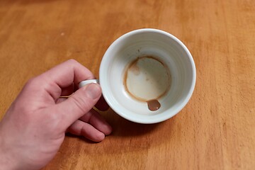 Image showing Running out of coffee, empty cup