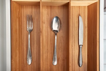 Image showing Minimalist kitchen tools put away in a drawer