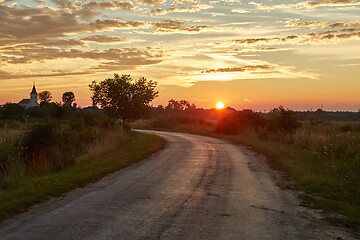 Image showing Country road through in glowing sunset