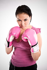 Image showing Businesswoman with boxing gloves