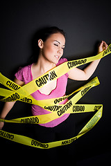 Image showing Businesswoman in caution tape