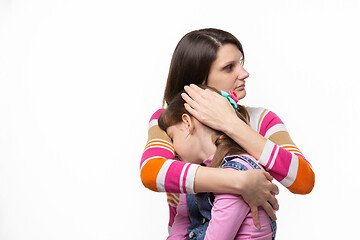 Image showing mom calms upset daughter isolated on white background