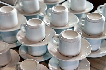 Image showing Clean coffee cups piled up