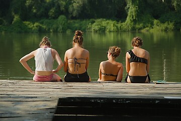 Image showing Girls by the river in summer