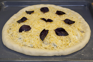 Image showing Fresh raw pizza quattro formaggi with 4 sorts of cheese.