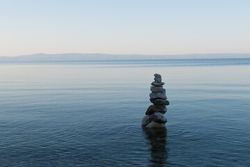 Image showing Balance stone pyramid on the sea coast