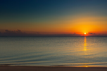 Image showing sunrise on sand beach