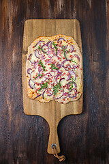 Image showing Flammkuchen - Traditional French dish tarte flambee cream cheese, bacon and onions