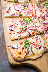 Image showing Flammkuchen - Traditional French dish tarte flambee cream cheese, bacon and onions