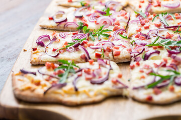 Image showing Flammkuchen - Traditional French dish tarte flambee cream cheese, bacon and onions