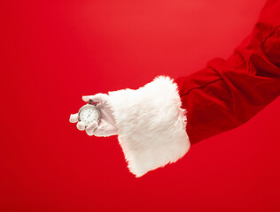 Image showing Santa holding a stopwatch in hand