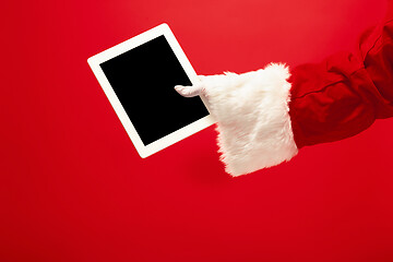 Image showing Santa Claus holding laptop