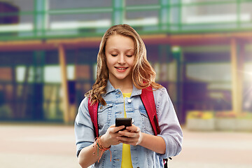 Image showing teen student girl with school bag and smartphone