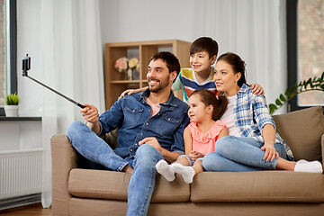 Image showing happy family taking selfie at home