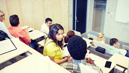 Image showing group of students with notebooks at lecture hall