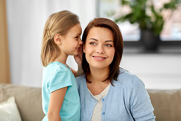 Image showing daughter whispering secret to mother at home