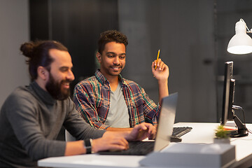 Image showing creative team with computer working late at office