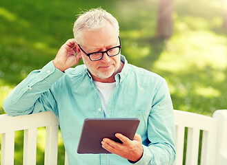 Image showing senior man with tablet pc at summer park