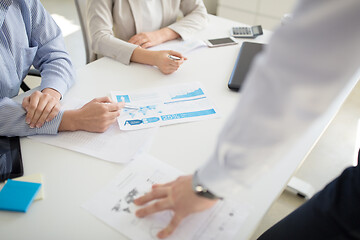 Image showing business team discussing charts at office