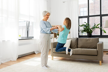 Image showing grandmother and granddaughter having fun at home