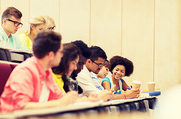 Image showing group of students with coffee writing on lecture