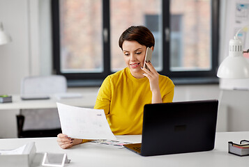 Image showing ui designer calling on smartphone at office