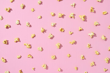 Image showing Food pattern from delicious popcorn on a light pink background.