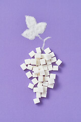 Image showing Refined sugar cubes as a grape fruit with leaf from granulated sugar.