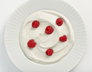 Image showing plate of greek yogurt with raspberries