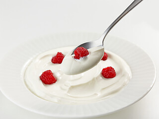 Image showing spoon of greek yogurt with raspberry