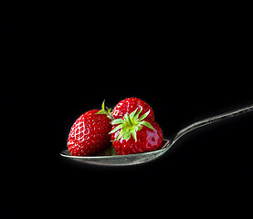 Image showing spoon of fresh strawberries