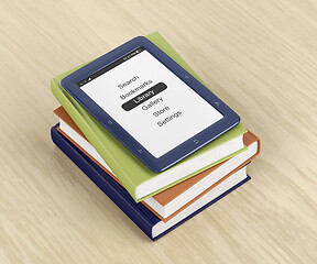 Image showing E-book reader on top of colorful books