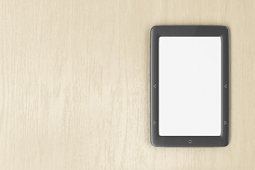Image showing E-book reader on wood desk