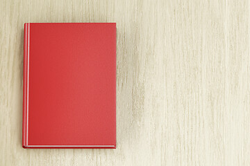 Image showing Red book on wood background