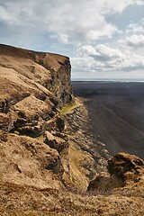 Image showing Icelandic landscape with cliffs and black sand