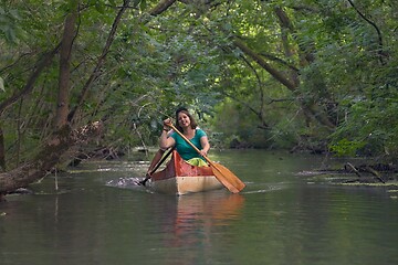 Image showing Canoe tour on a river