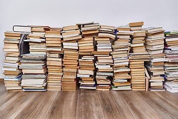 Image showing Wall of books piled up