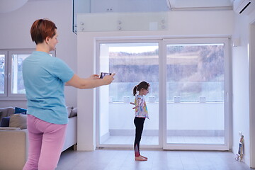 Image showing family at home little girl have online ballet training