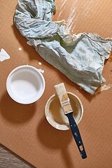 Image showing Paint brush on a can of white wall paint