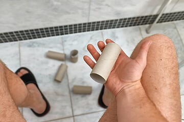 Image showing Finding empty roll in the restroom